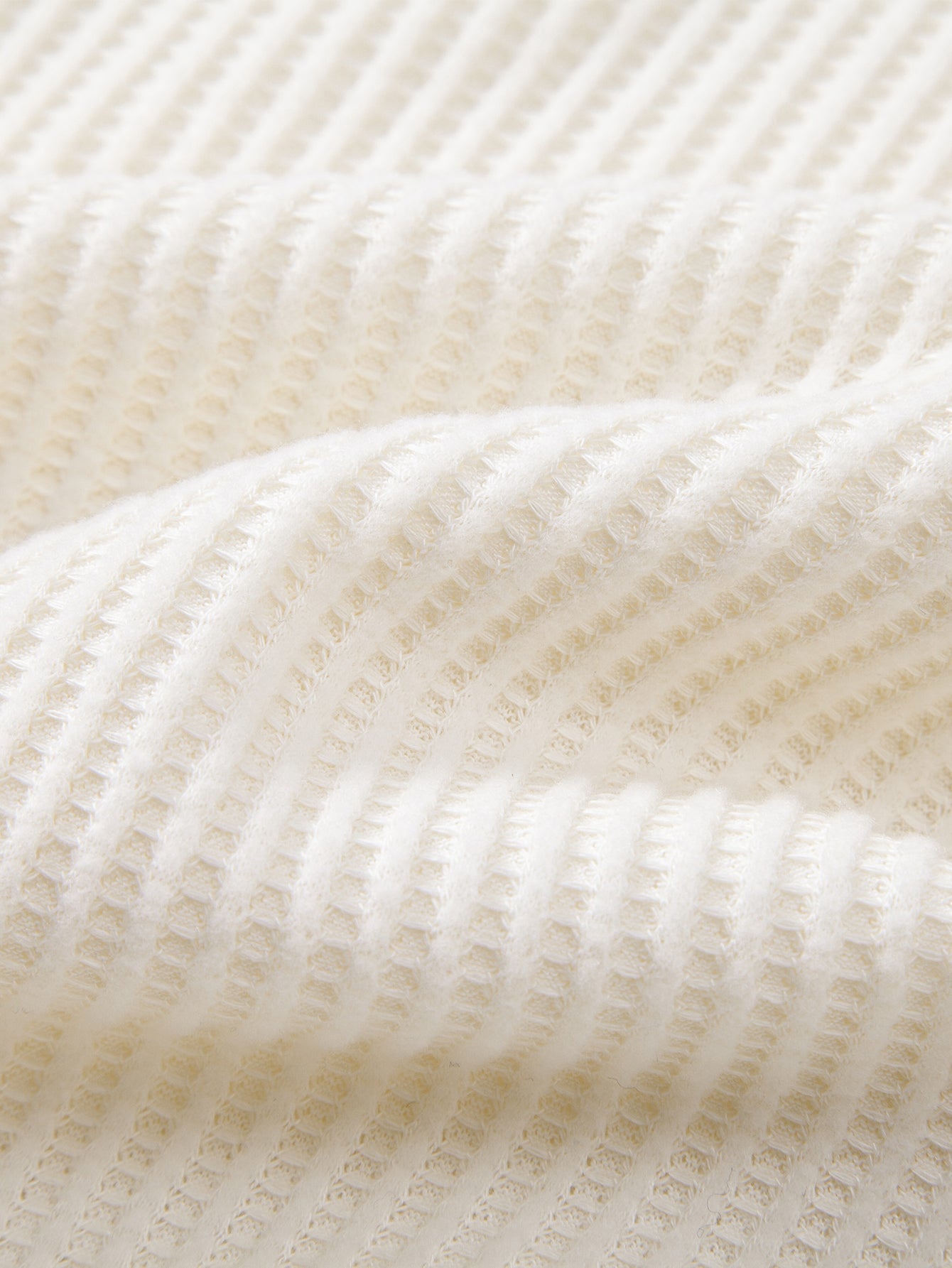 Polo de punto de manga larga con estampado de gofre y pantalones de punto con cordón