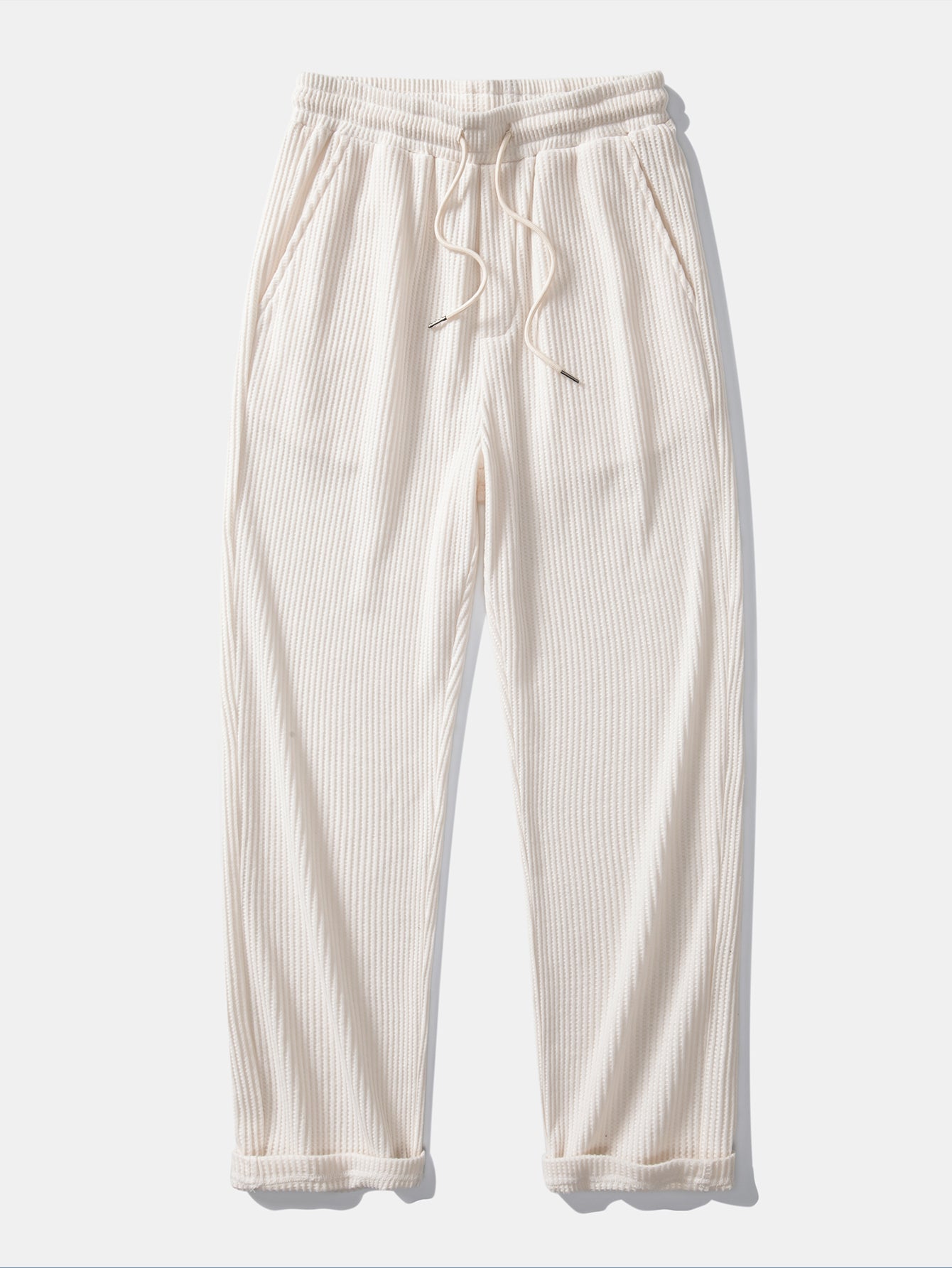 Polo de punto de manga larga con estampado de gofre y pantalones de punto con cordón