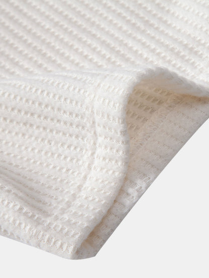 Polo de manga corta con estampado de gofre y pantalones cortos de punto con cordón