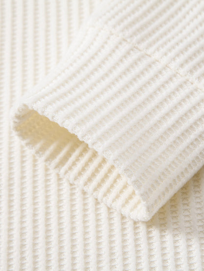 Polo de punto de manga larga con estampado de gofre y pantalones de punto con cordón